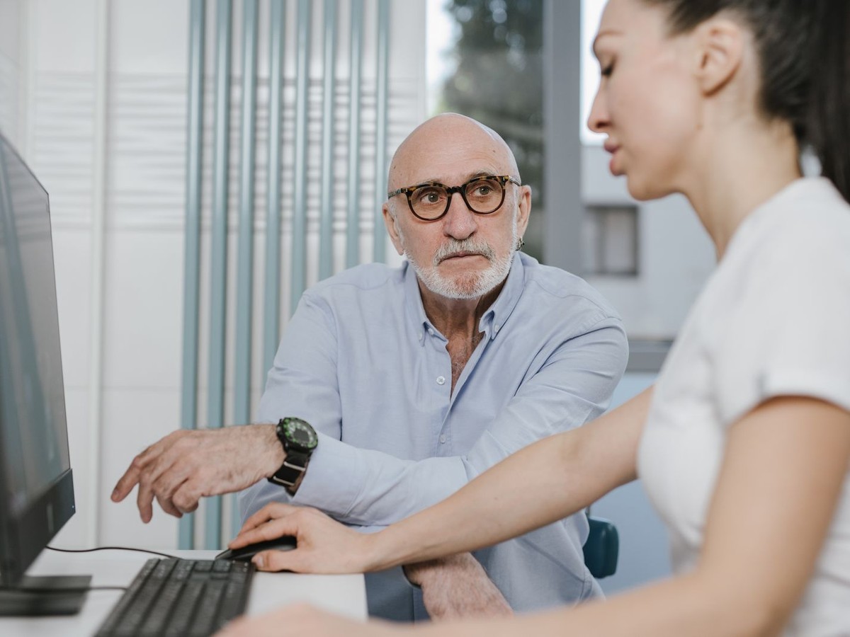 Older patient consulting with a doctor